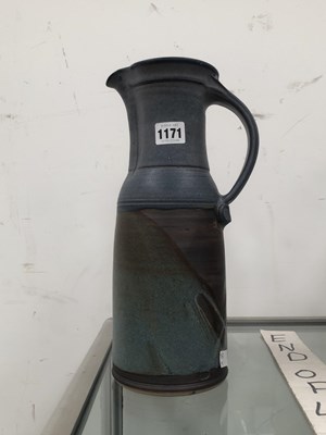 Lot 1171 - A studio pottery ewer glazed in tones of grey...