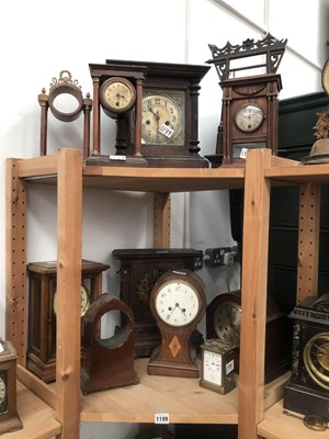 Lot 1199 - Seven mantle clocks, two clock cases, an arch...