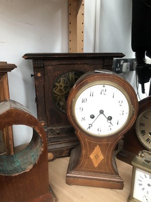 Lot 1199 - Seven mantle clocks, two clock cases, an arch...