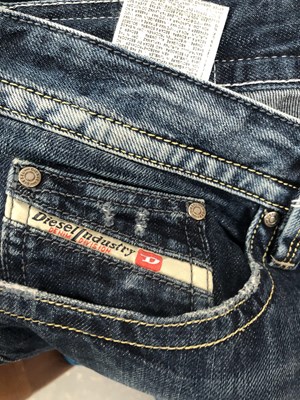 Lot 648 - Four pairs of Diesel jeans one size 31 and...