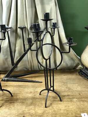 Lot 5 - Two pairs of wrought iron candelabra, one pair...