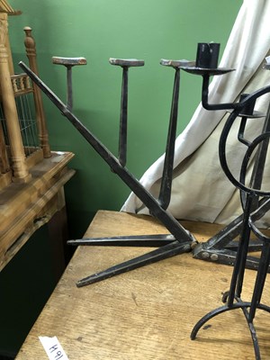 Lot 5 - Two pairs of wrought iron candelabra, one pair...