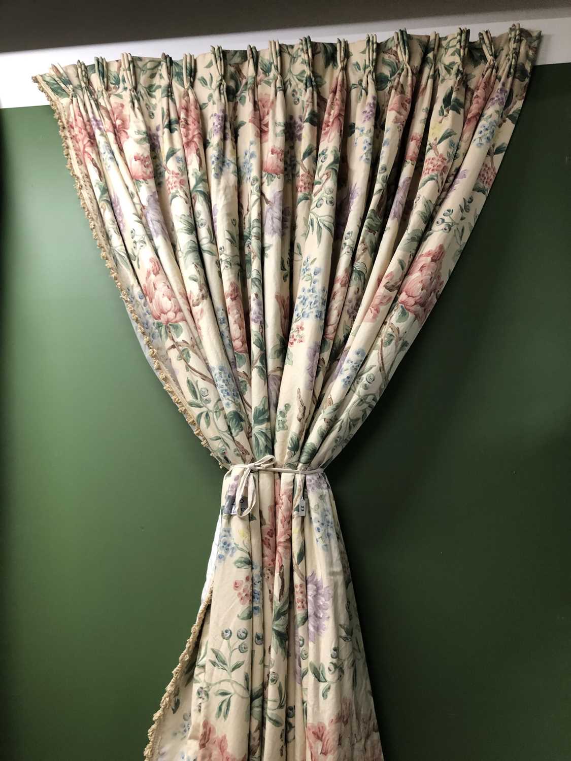 Lot 23 - Four floral chintz interlined curtains...