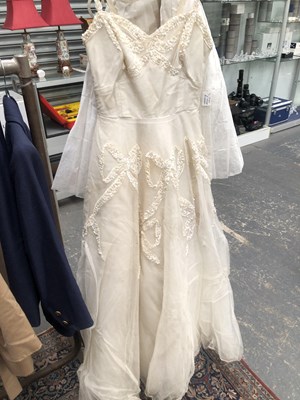 Lot 663 - Ladies clothing. A vintage wedding gown with a...