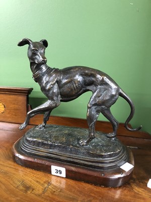 Lot 39 - Style of P J Mene, a bronze whippet poised on...