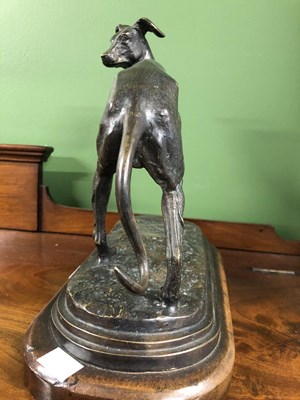 Lot 39 - Style of P J Mene, a bronze whippet poised on...
