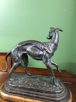 Lot 39 - Style of P J Mene, a bronze whippet poised on...