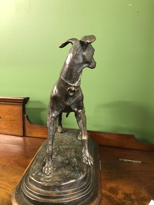 Lot 39 - Style of P J Mene, a bronze whippet poised on...