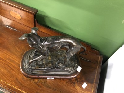 Lot 39 - Style of P J Mene, a bronze whippet poised on...