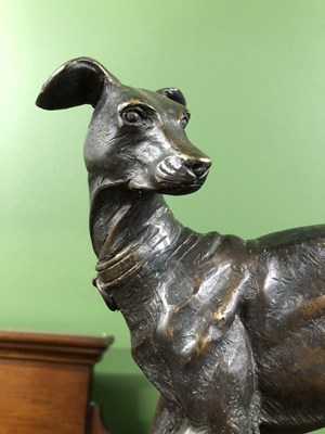 Lot 39 - Style of P J Mene, a bronze whippet poised on...