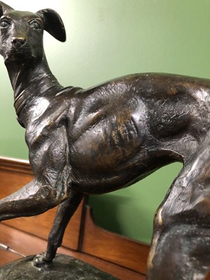 Lot 39 - Style of P J Mene, a bronze whippet poised on...