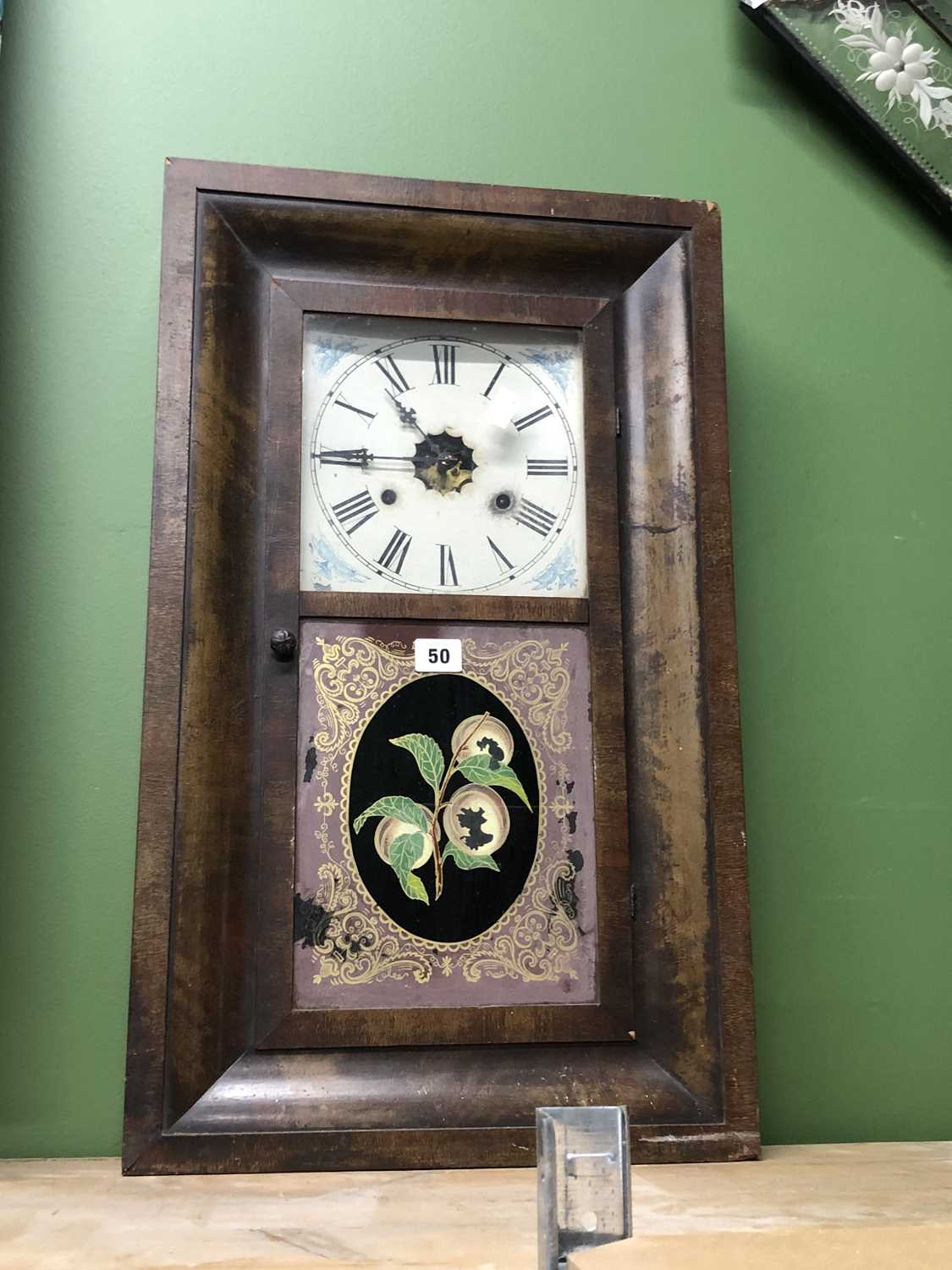 Lot 50 - A glazed walnut cased wall clock labelled for...
