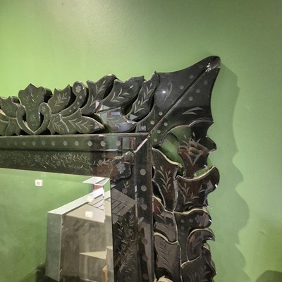 Lot 53 - A bevelled glass rectangular mirror within a...