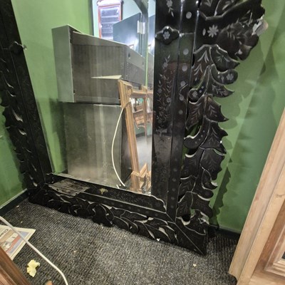 Lot 53 - A bevelled glass rectangular mirror within a...