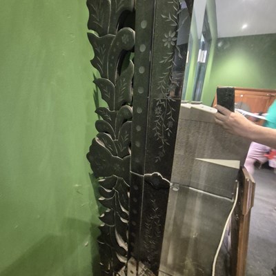 Lot 53 - A bevelled glass rectangular mirror within a...