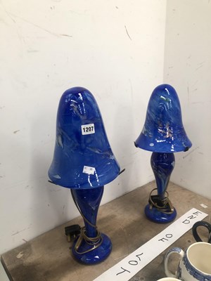 Lot 1207 - A pair of Giot blue glass table lamps with...