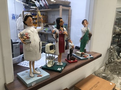 Lot 1214 - Four Forchino carictures of medical figures