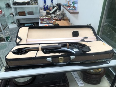 Lot 1220 - A cased electric violin