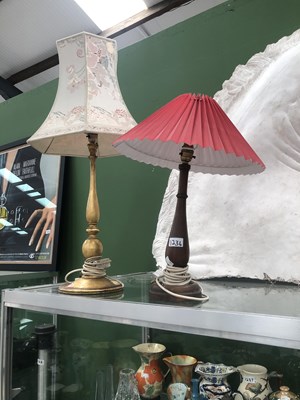Lot 1234 - A wooden table lamp together with another in...