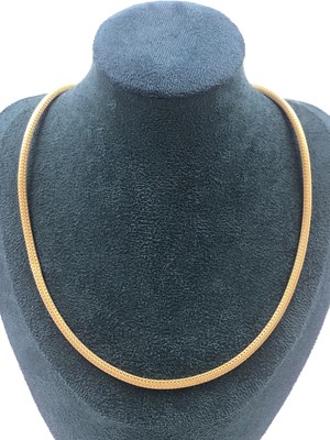 Lot 504 - A mesh herringbone style neckchain. Stamped...