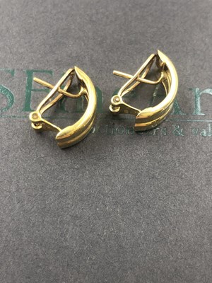 Lot 505 - A pair of contemporary pierced earrings with...