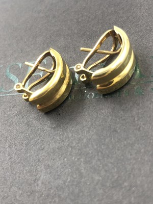 Lot 505 - A pair of contemporary pierced earrings with...