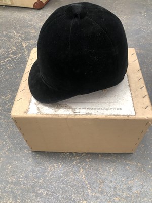 Lot 699 - Herbert Johnson. A vintage black riding hat...