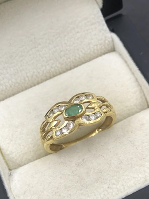 Lot 513 - A vintage emerald and diamond ring. The oval...