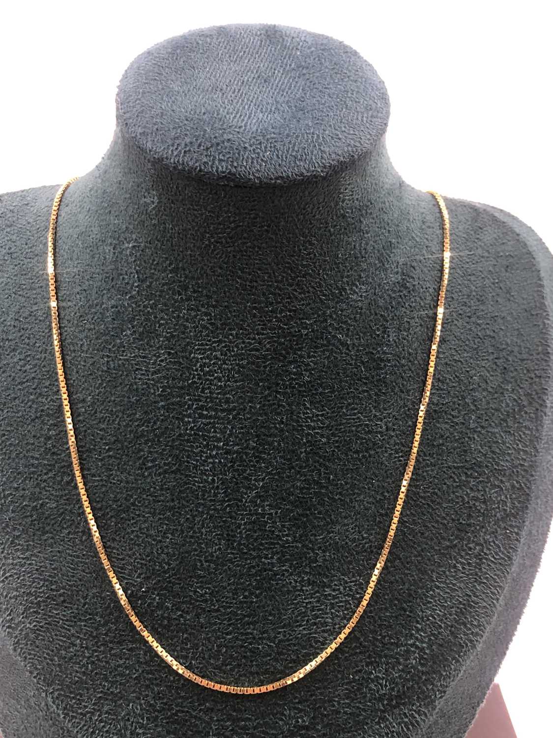 Lot 516 - A boxlink pendant chain. Unhallmarked, stamped...