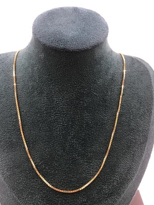 Lot 516 - A boxlink pendant chain. Unhallmarked, stamped...