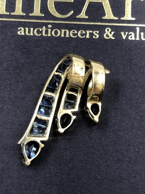 Lot 519 - A contemporary blue gemset triple cascade...