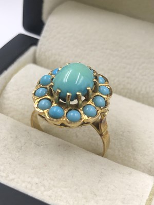 Lot 526 - A vintage turquoise cluster ring. Unhallmarked,...