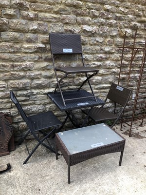 Lot 1307 - A patio table , three chairs and a drinks table.