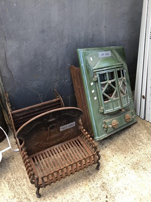 Lot 1320 - An enamel-finished iron solid fuel heater and...
