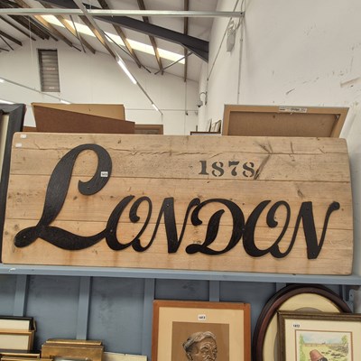 Lot 1415 - A large wood and iron sign "London"