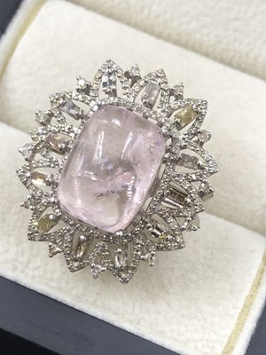 Lot 530b - A central cushion cabochon morganite, with...