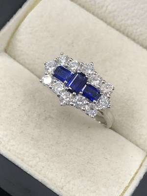 Lot 540a - A hallmarked platinum, sapphire and diamond...