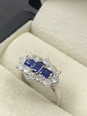 Lot 540 - A hallmarked platinum, sapphire and diamond...