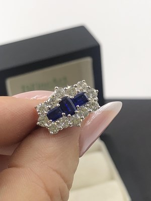 Lot 540 - A hallmarked platinum, sapphire and diamond...