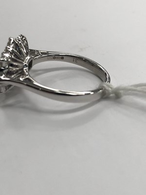 Lot 540 - A hallmarked platinum, sapphire and diamond...