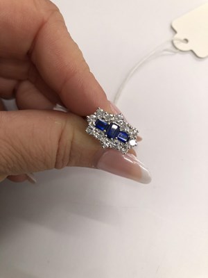 Lot 540 - A hallmarked platinum, sapphire and diamond...