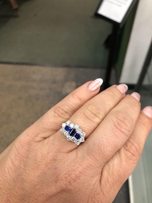 Lot 540 - A hallmarked platinum, sapphire and diamond...