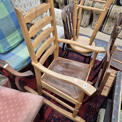 Lot 107 - An arts and crafts style ladder back rocking...
