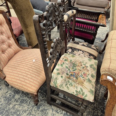 Lot 114 - A pair of carved oak side chairs.