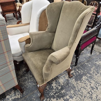 Lot 118 - A George I style wing back armchair.