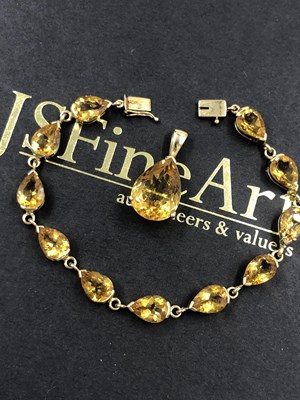 Lot 611 - A 9ct hallmarked gold orange gemset bracelet...
