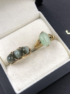 Lot 546 - A three-stone cabochon and diamond set ring,...