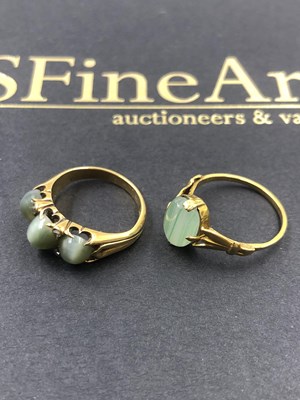 Lot 546 - A three-stone cabochon and diamond set ring,...