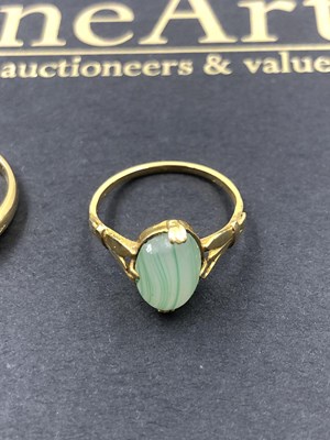 Lot 546 - A three-stone cabochon and diamond set ring,...