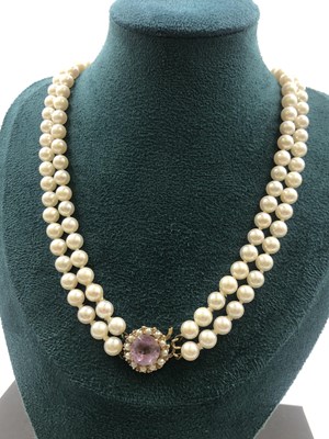 Lot 568 - A double row cultured pearl necklace, with a...